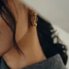 Éole Wavy Hoop Ohrringe, vergoldete Edition